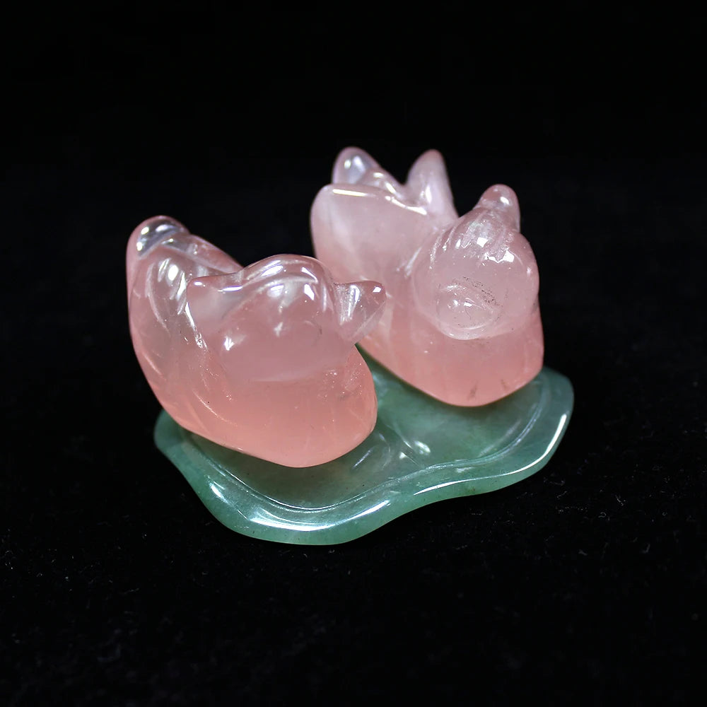 Rose quartz ducks on display – romantic crystal decor for bedroom or altar