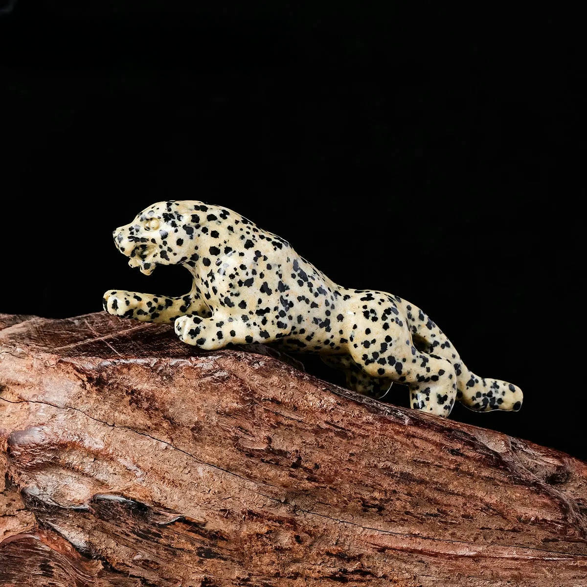 spotted stone leopard figurine