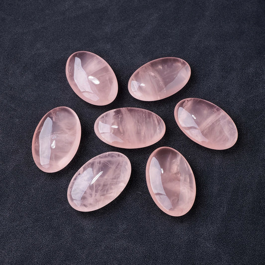 Polished rose quartz palm stone crystal