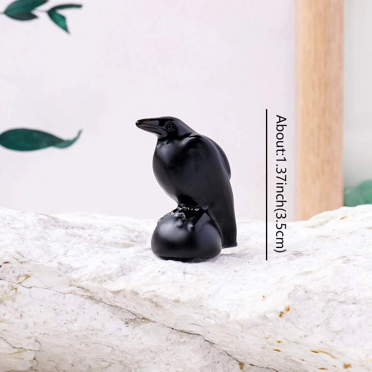Mysterious black crow statue made of obsidian