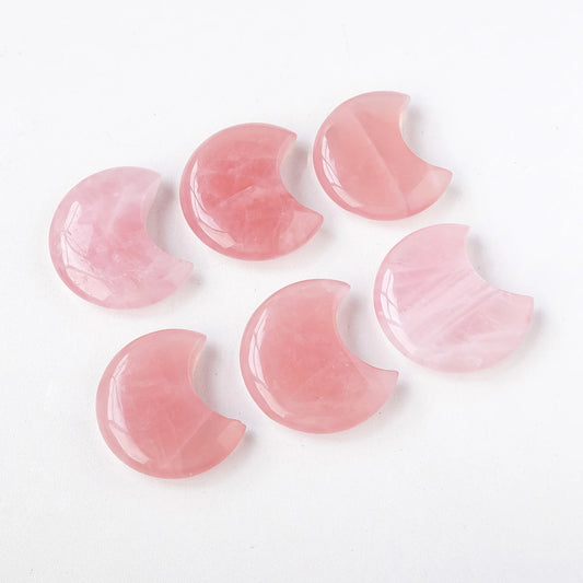 Hand holding rose quartz moon – heart chakra healing pocket stone

