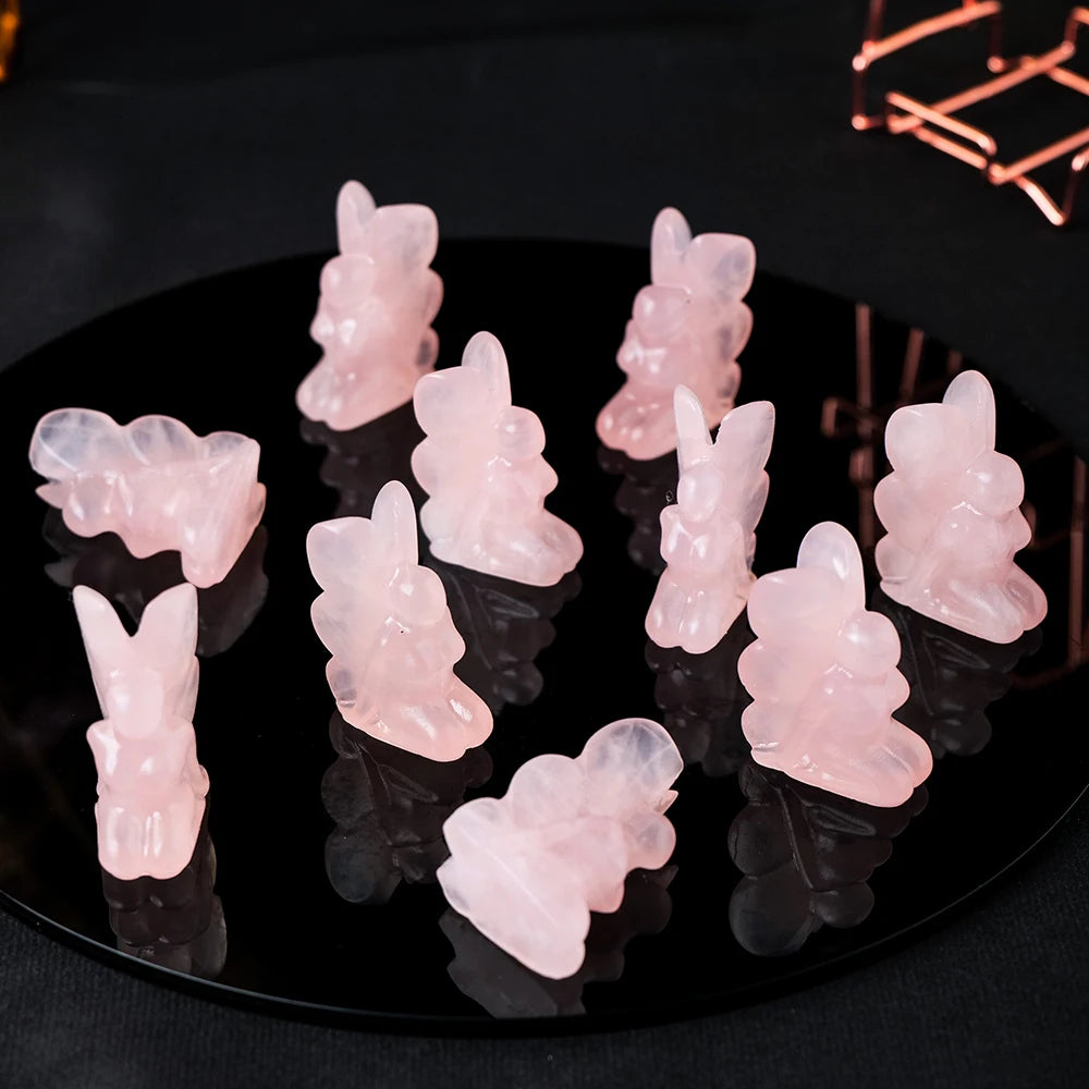 Rose quartz angel figurine displayed in living room, bringing positive energy and calm ambiance