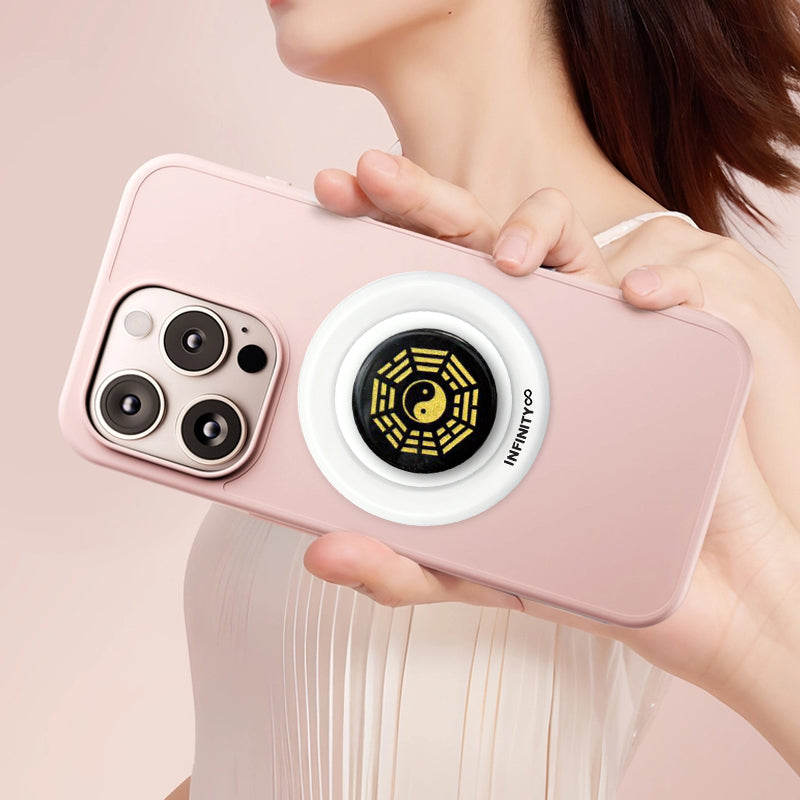 INFINITY Obsidian Bagua phone grip used during energy ritual or journaling