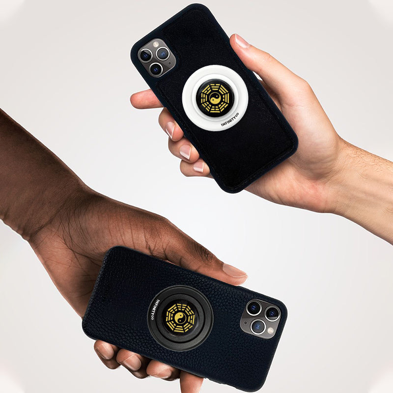 Obsidian Bagua crystal grip resting on meditation mat with incense