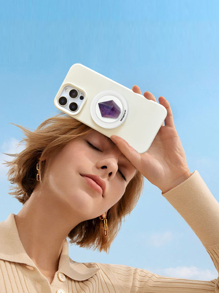 Close-up of natural amethyst crystal used as MagSafe phone grip